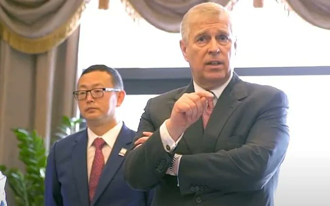 Prince Andrew speaking with Yang Tengbo.