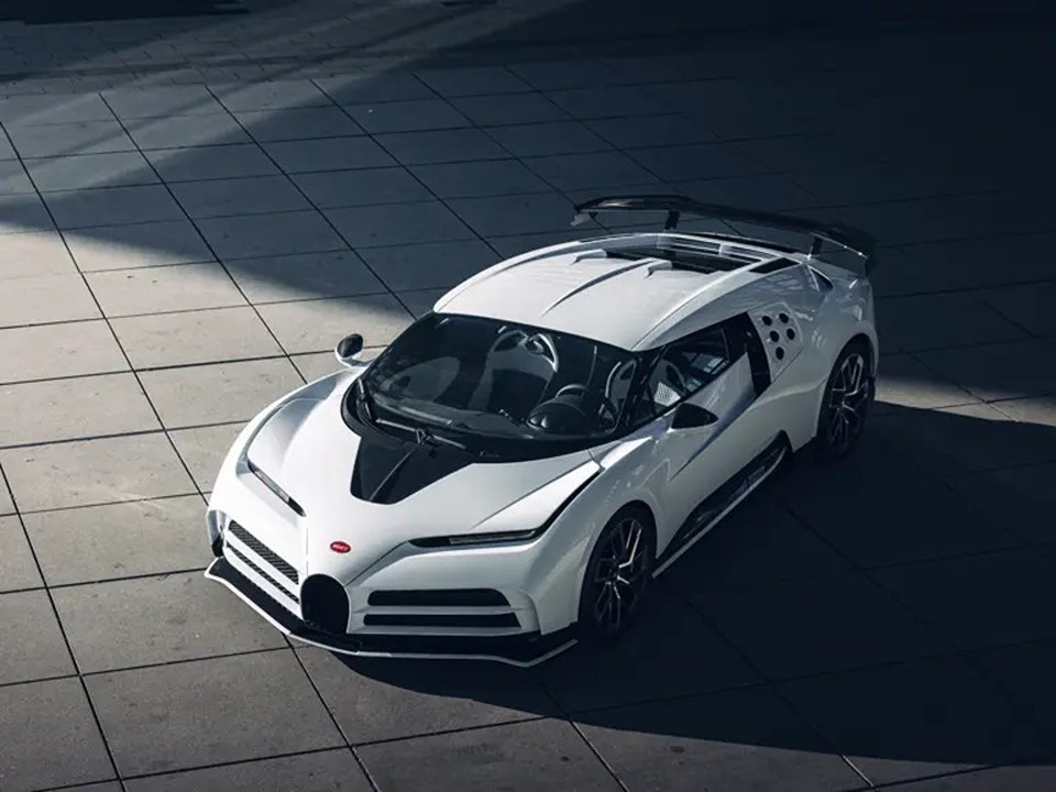 White Bugatti Centodieci parked on a tiled surface.