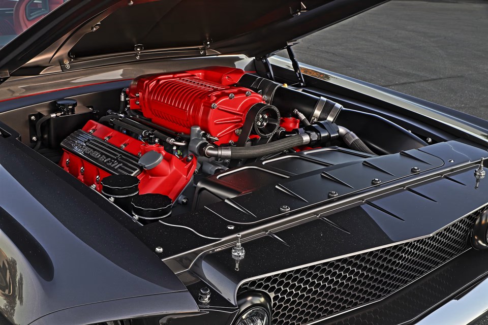 Close-up of a custom 1967 Ford Mustang Fastback's 5.4L supercharged V-8 engine.