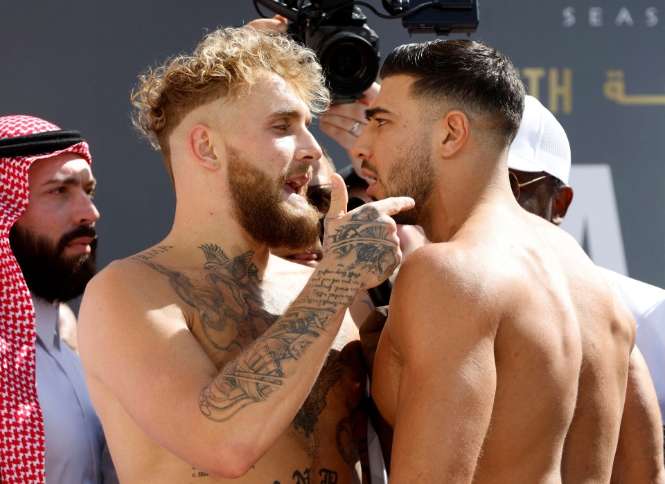 Jake Paul and Tommy Fury face off at a weigh-in.