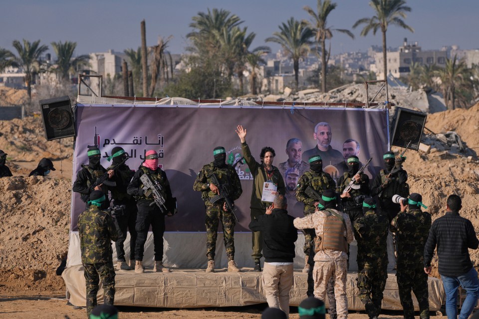 Israeli hostage waving after release by Hamas.