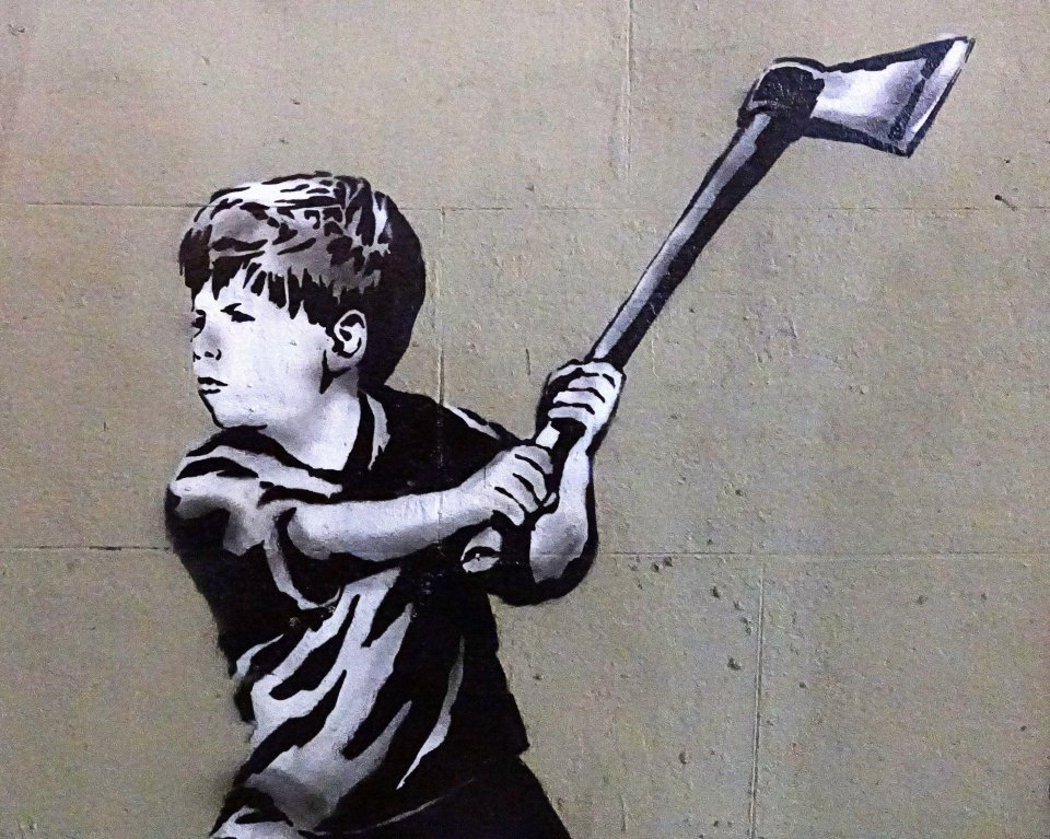 Banksy artwork of a child wielding an axe.