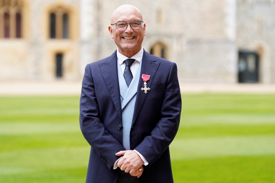 Gregg Wallace wearing an OBE medal at Windsor Castle.