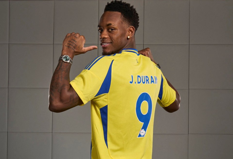 Jhon Duran, Al Nassr's new signing, wearing a yellow jersey with number 9.