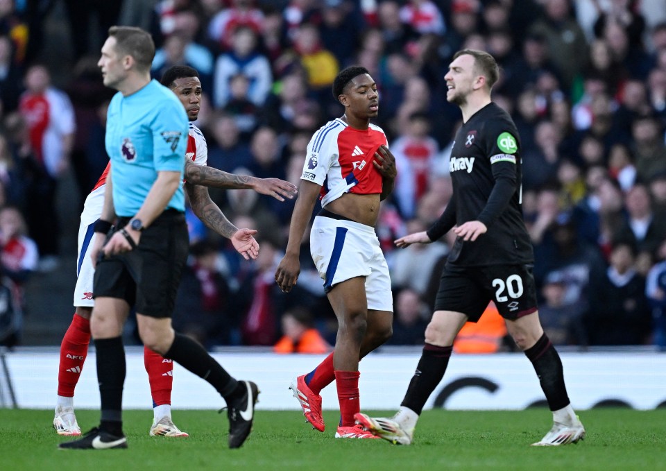 Arsenal's Myles Lewis-Skelly reacts after receiving a red card.