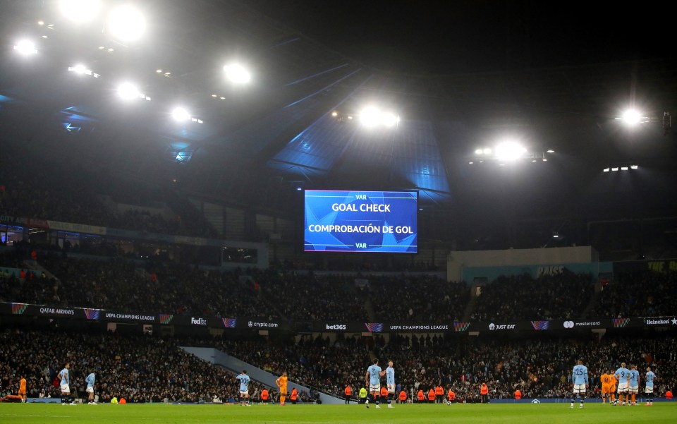 Stadium jumbotron displays a VAR goal check message.