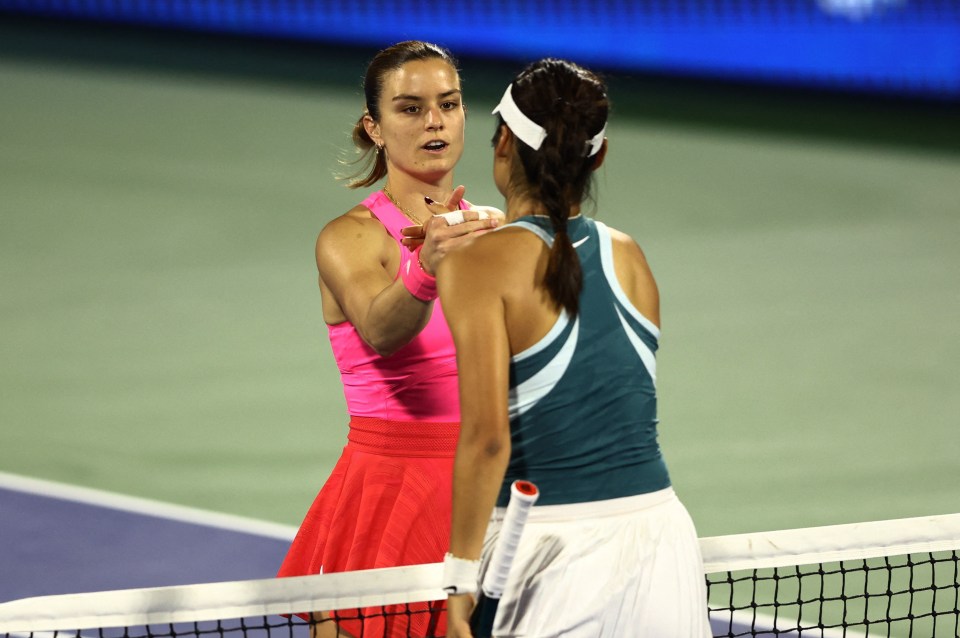 Emma Raducanu and Maria Sakkari shaking hands after a tennis match.