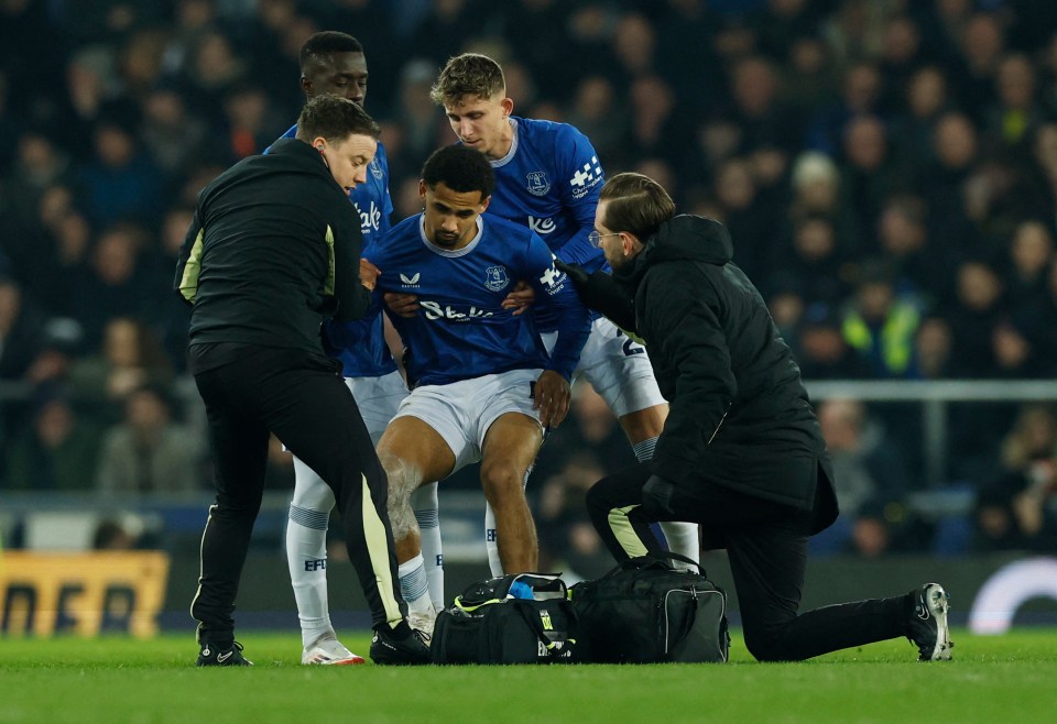 Everton's Iliman Ndiaye receiving medical attention on the field.