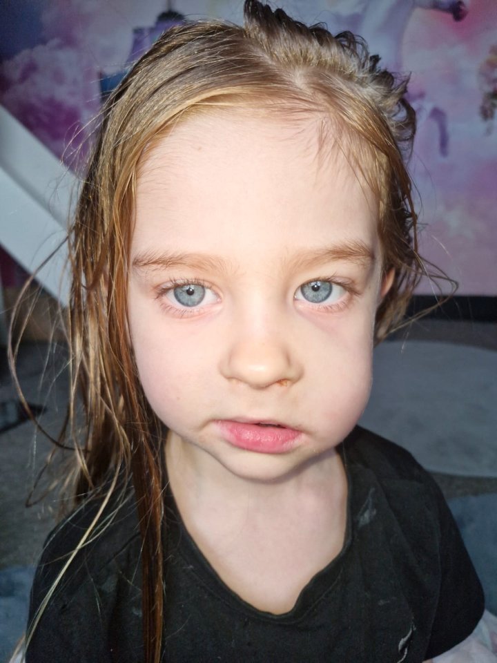 Portrait of a young girl with blonde hair.