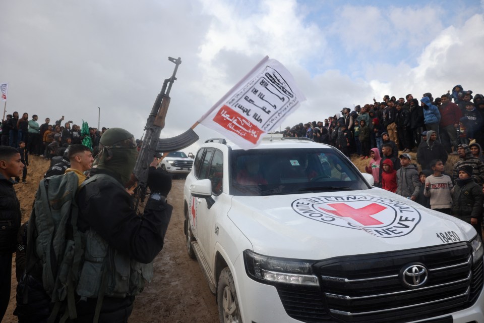 Hamas militants at the handover of Israeli hostages in Khan Yunis.