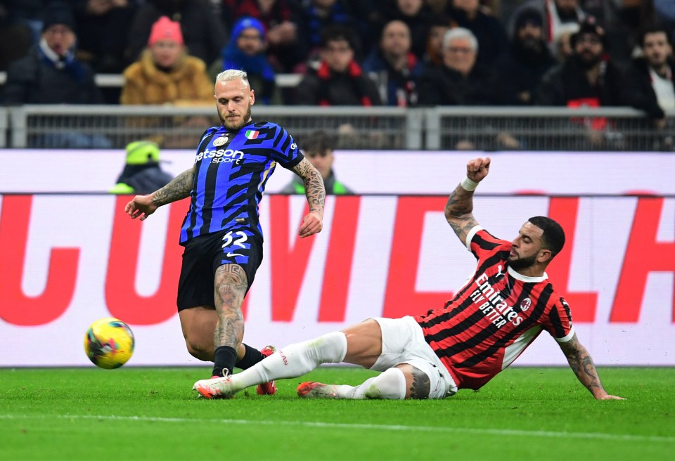 Federico Dimarco of Inter Milan in action against an AC Milan player.