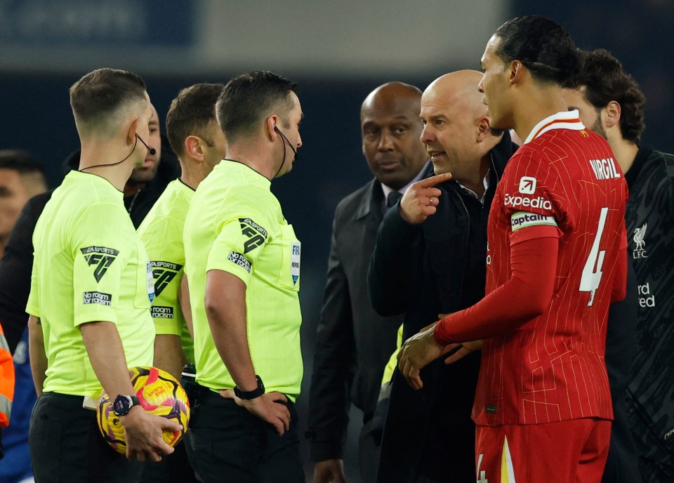 Liverpool manager Arne Slot arguing with a referee.