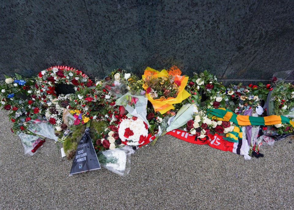 Floral tributes outside Old Trafford before Denis Law's funeral.