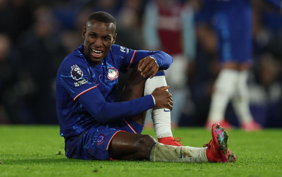 Nicolas Jackson of Chelsea in pain on the field.