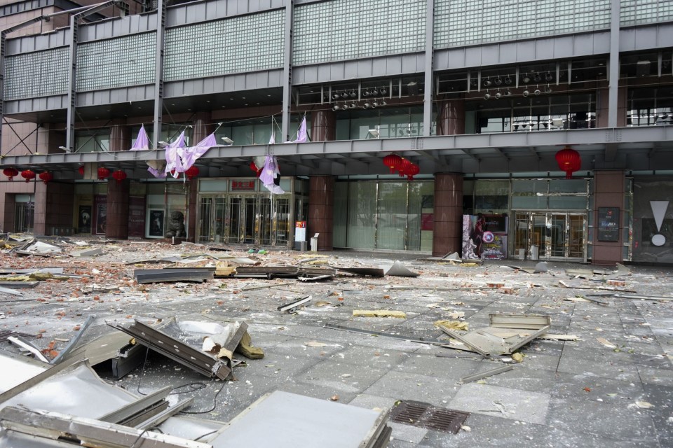 Debris outside a department store after a gas explosion.