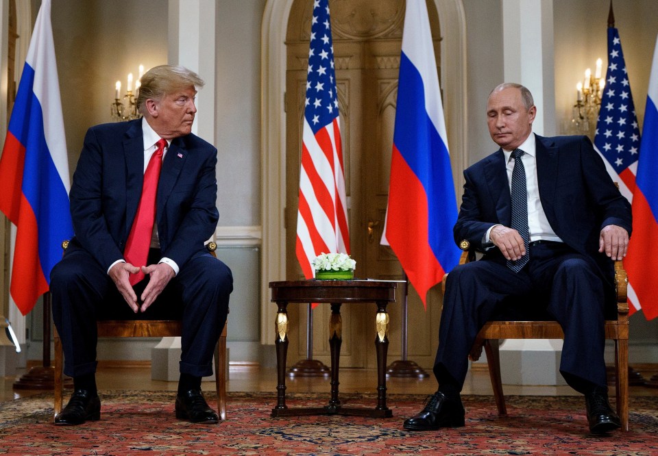 Presidents Trump and Putin seated together in a meeting.