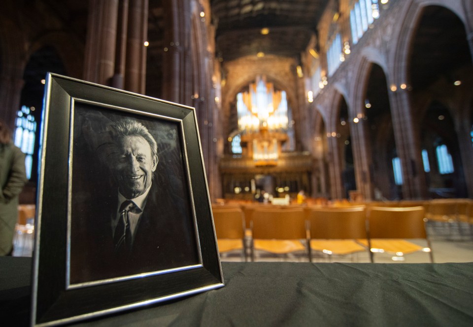 Framed portrait of Denis Law in Manchester Cathedral.