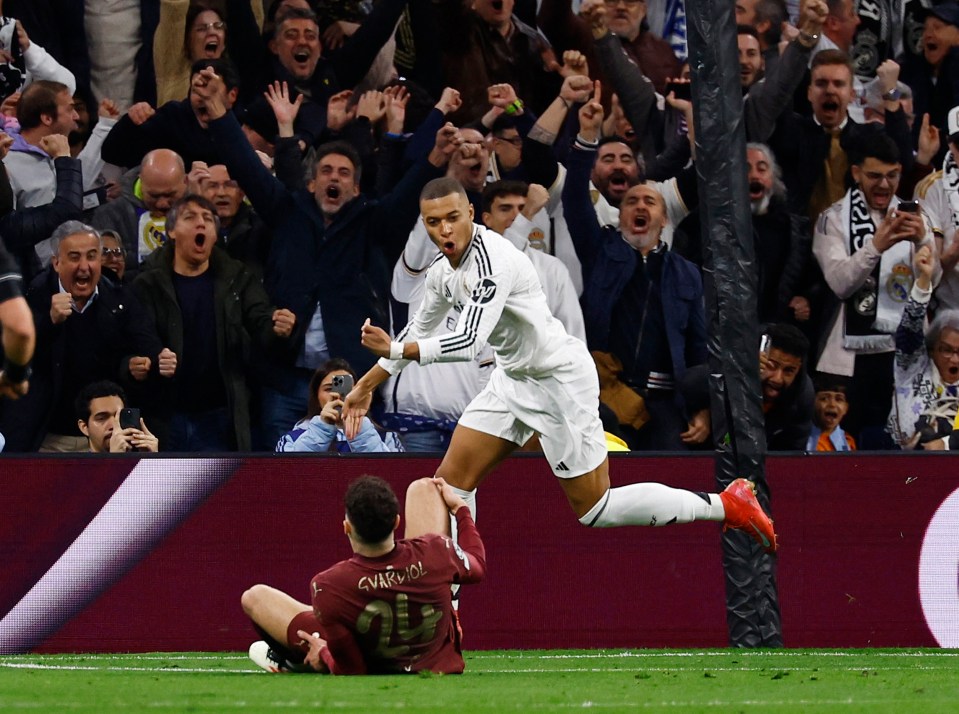 Kylian Mbappé celebrates scoring a goal as Josko Gvardiol reacts.