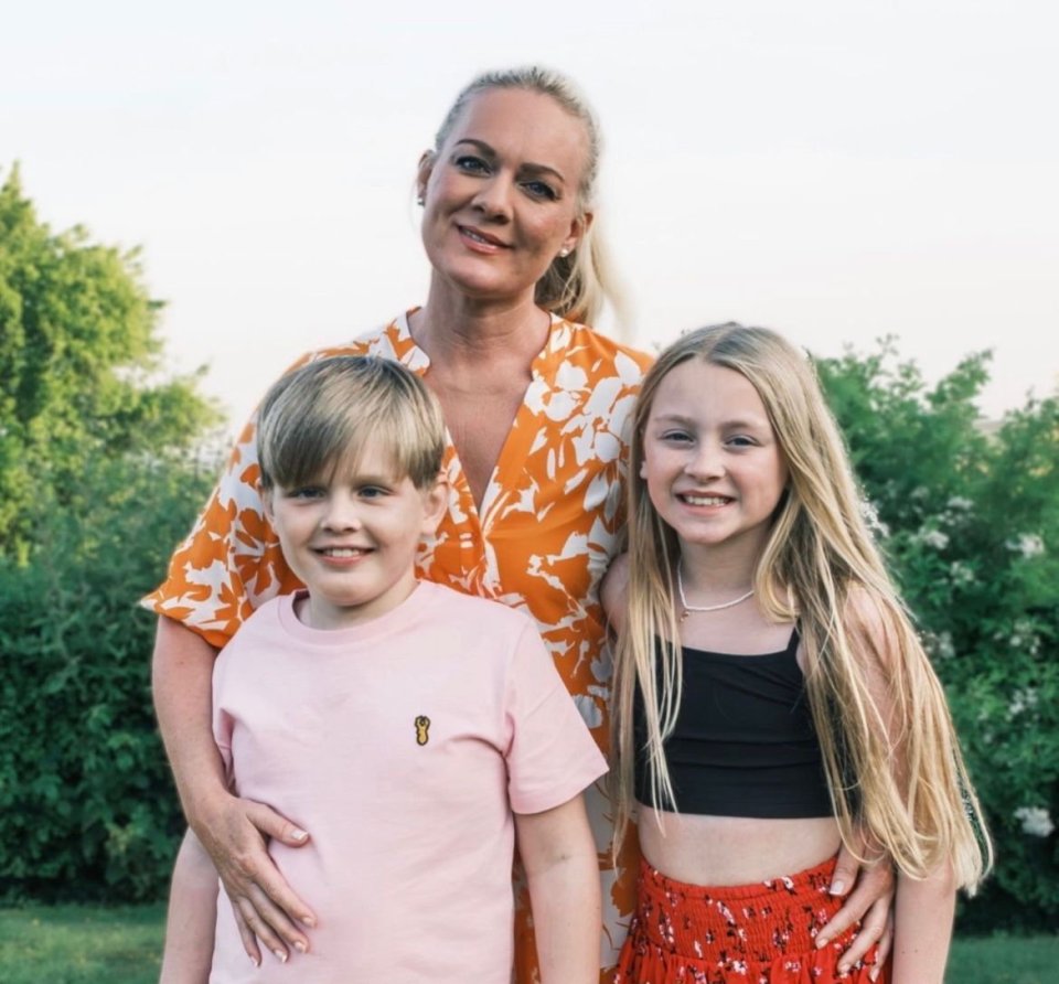 Photo of a mother with her two children.