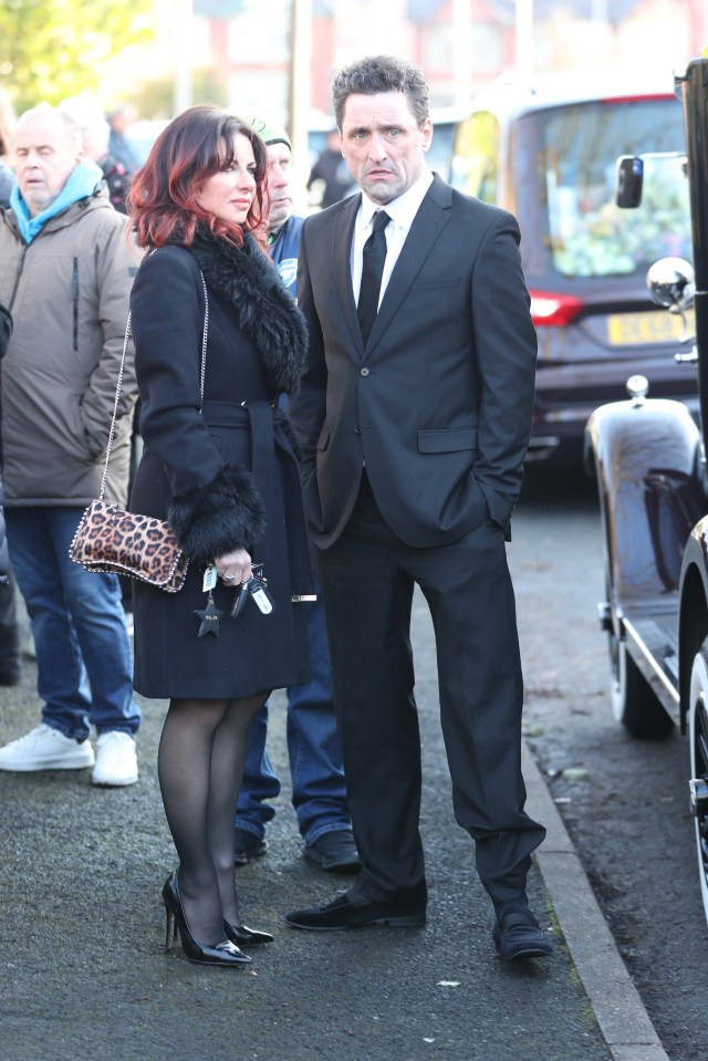 Danny Taylor and a redhead woman at Linda Nolan's funeral.