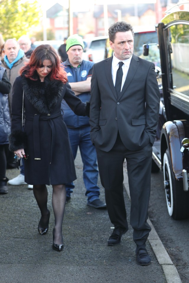 Danny Taylor and a woman arrive at Linda Nolan's funeral.