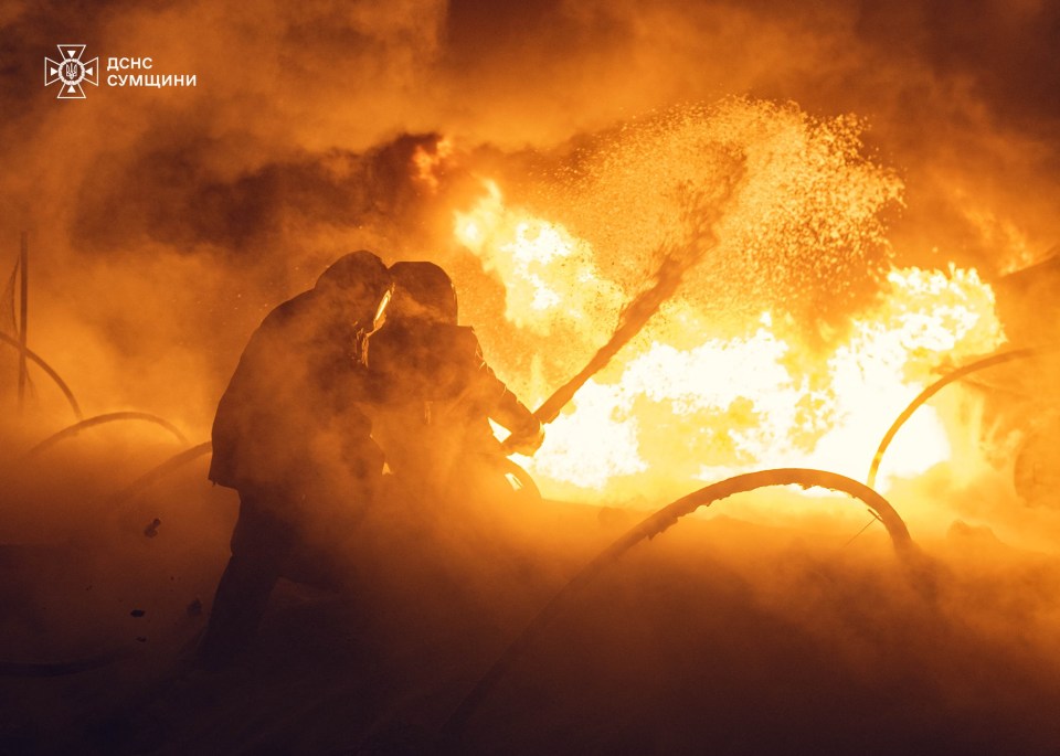 Firefighters battling a large fire.