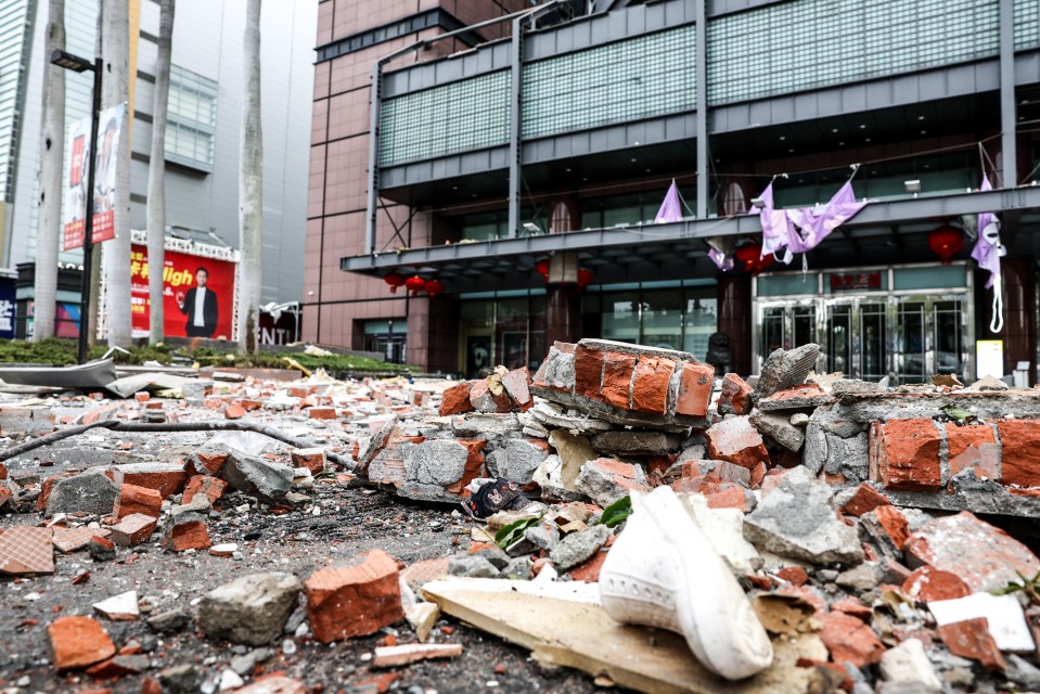 Debris from a gas explosion litters the entrance of a department store.