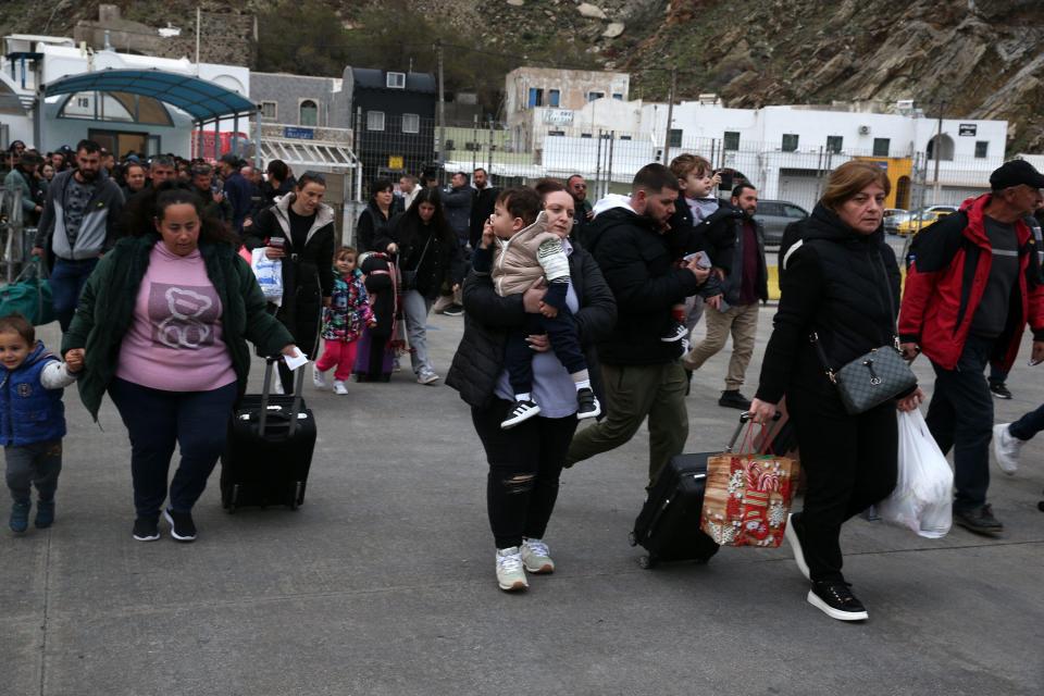 People evacuate Santorini by ferry after earthquakes.