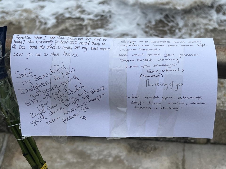 Floral tributes and handwritten notes expressing grief and love for Saffron Cole-Nottage.