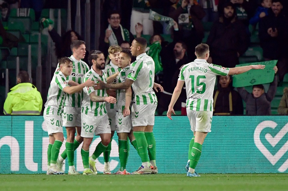 Real Betis players celebrating a goal.