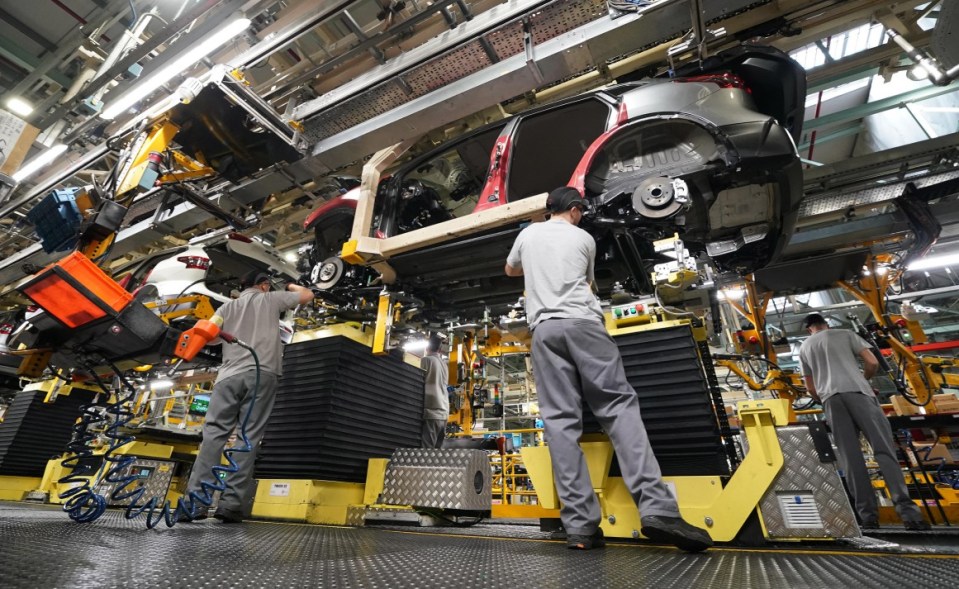 2A3W30A Workers on the production line at Nissan's factory in Sunderland after they were told that the car manufacturer is to end the night shift at its UK plant.