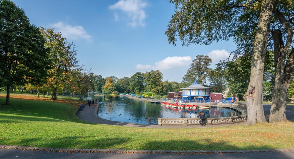 Panoramic view of Lister Park's boating lake in Bradford, West Yorkshire.