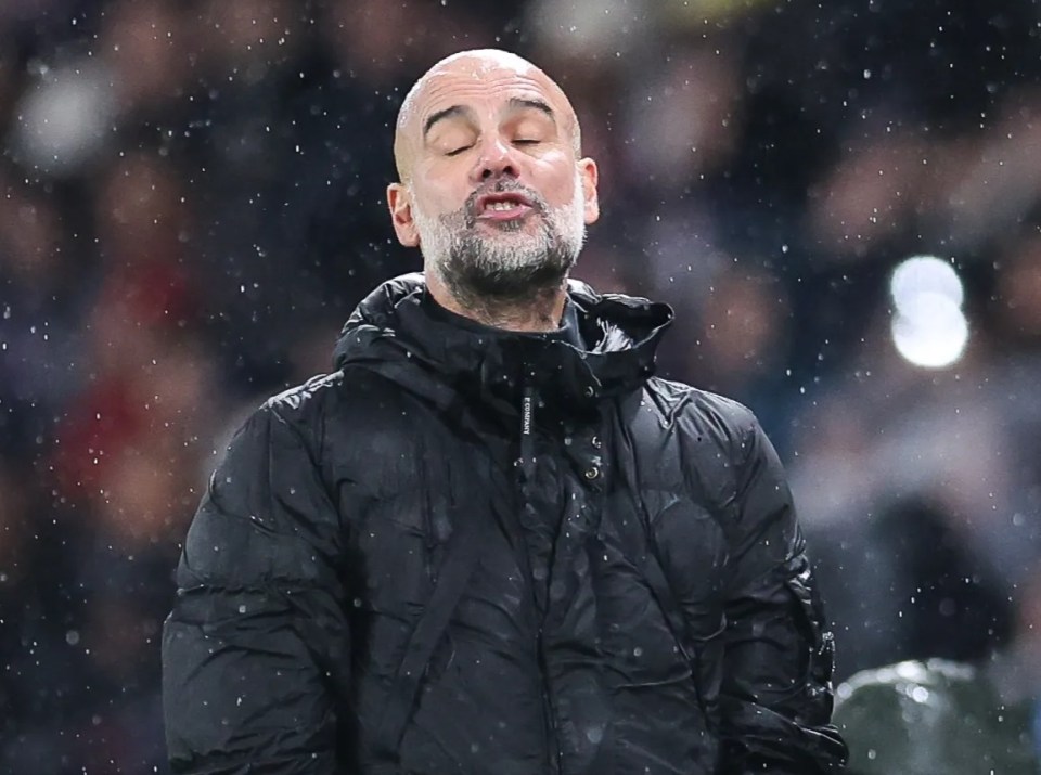 Pep Guardiola looking dejected during a soccer match.