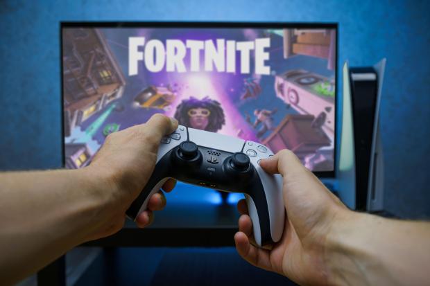 Person playing Fortnite on Playstation 5.