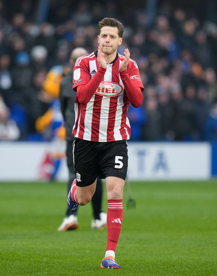 Jack Fitzwater of Exeter City saluting fans.