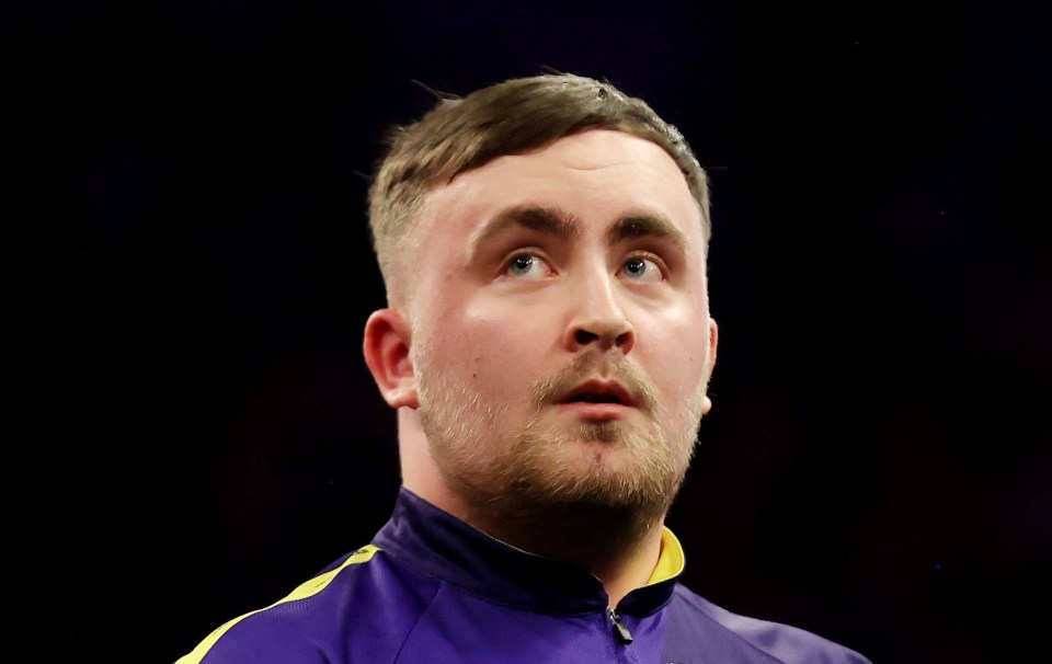 Luke Littler at a darts match.