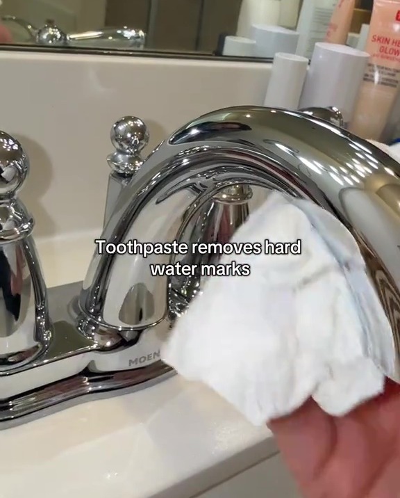 Toothpaste removing hard water marks from a chrome faucet.