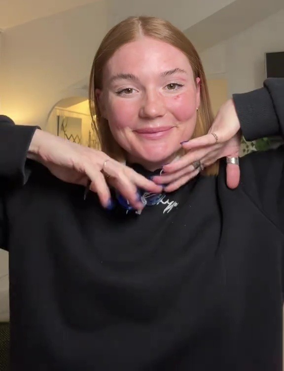 Woman showing off her straight hair after a DIY treatment.