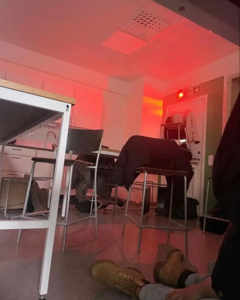 Red-lit classroom during lockdown.