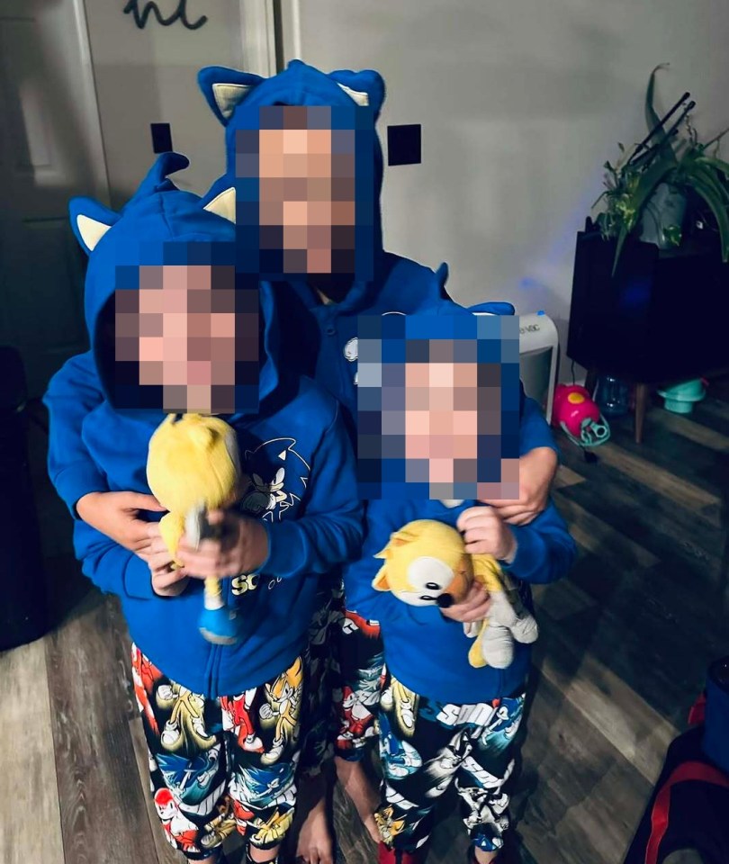 Three children in Sonic the Hedgehog pajamas at a doctor's appointment.