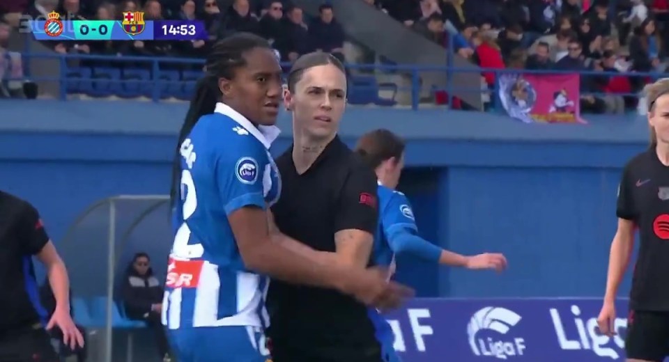 Women's soccer players in a heated on-field confrontation.