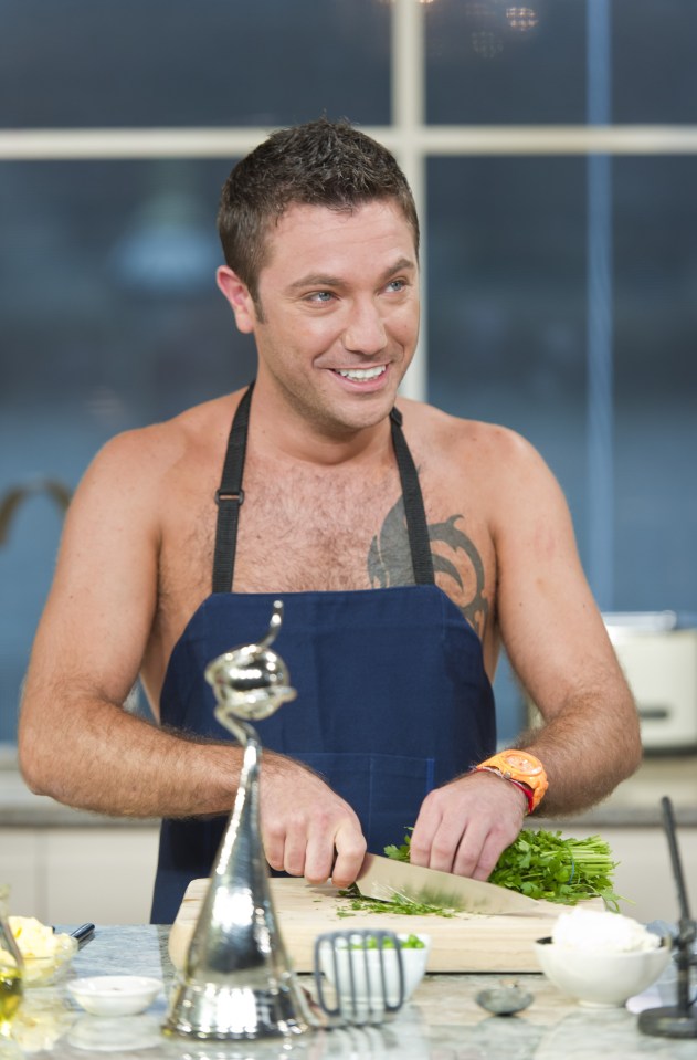 Gino D'Acampo cooking while shirtless, fulfilling a promise made after winning an NTA award.