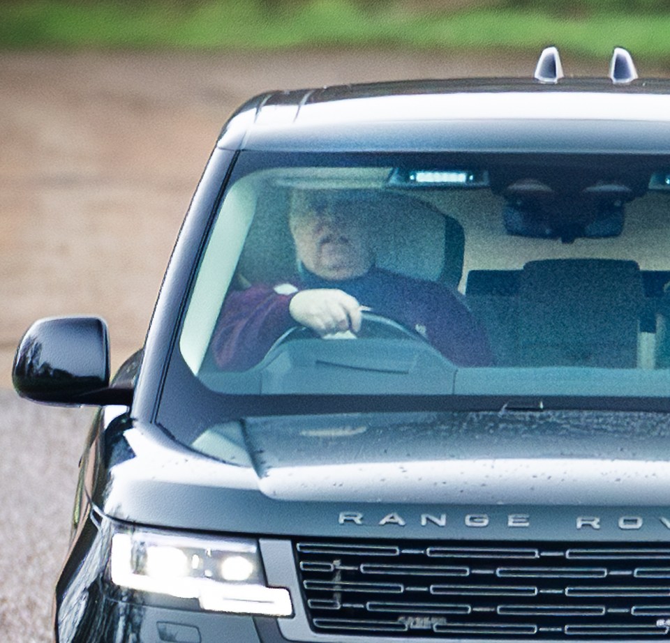 Prince Andrew driving a Range Rover.