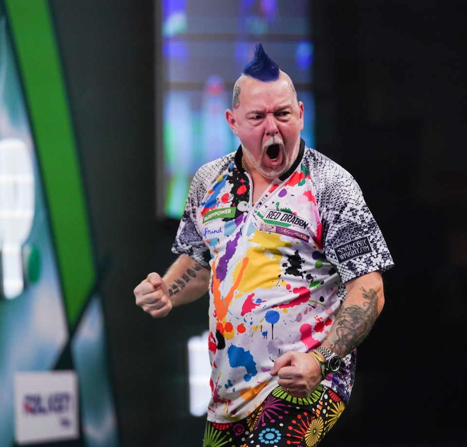 Peter Wright celebrating during a darts match.