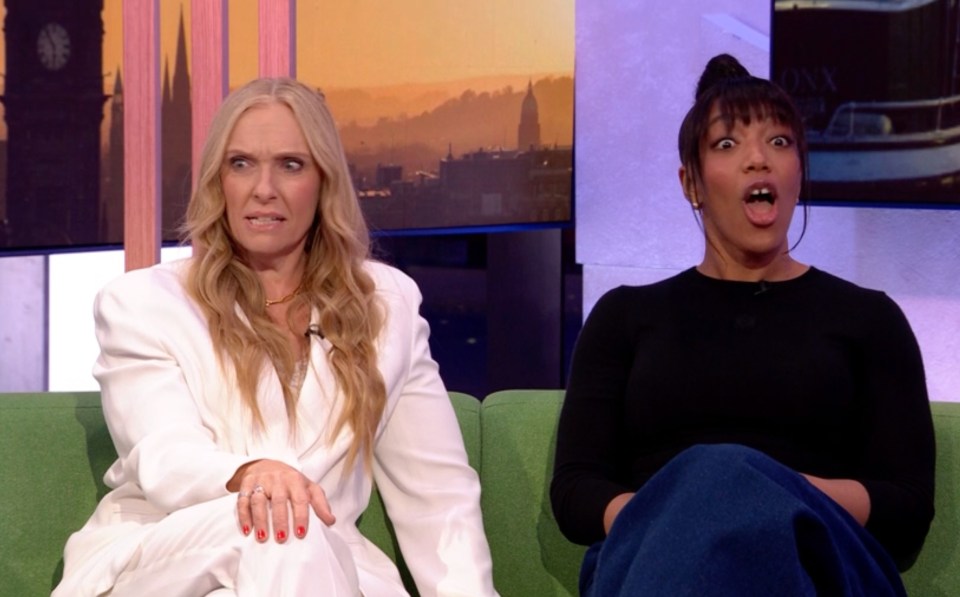 Screenshot of two women sitting on a green couch, one looking surprised and the other looking skeptical.