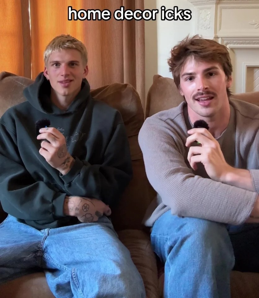 Two men sitting on a couch discussing home decor dislikes.