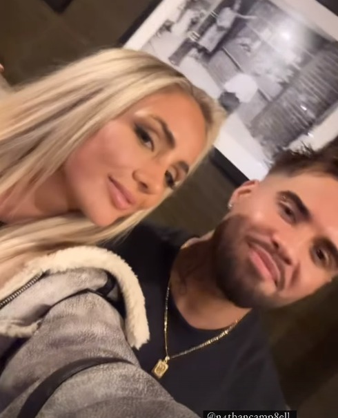 Close-up selfie of a blonde woman and a man.