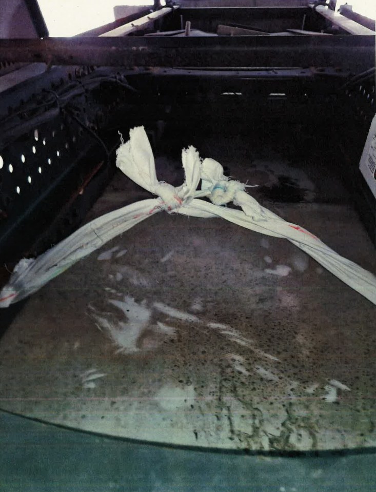 Photo of bedsheets tied under a truck used in a prison escape.