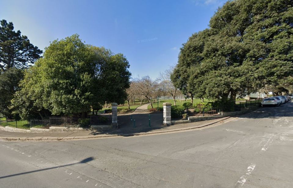 Park entrance with paved path.