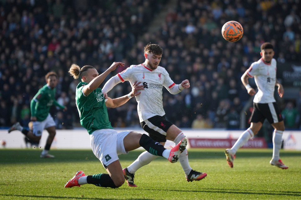 Plymouth Argyle's Maksym Talovyerov, left, vies for the ball with Liverpool's Harvey Elliott during the English FA Cup fourth round soccer match between Plymouth Argyle and Liverpool at Home Park stadium in Plymouth, England, Sunday, Feb. 9, 2025. (AP Photo/Alastair Grant)